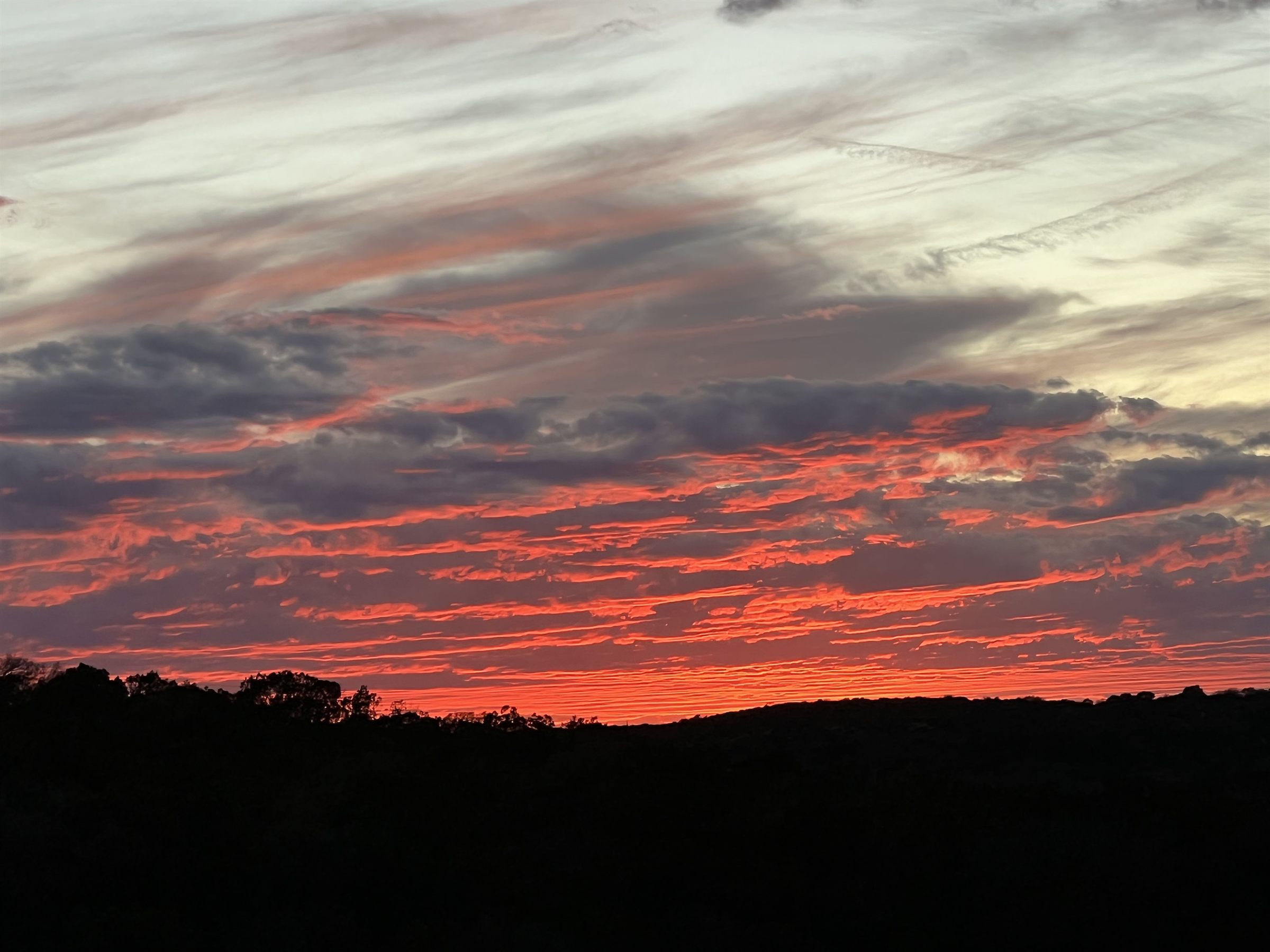 Fiery sunset over the ridgeline at 3 Hollows Ranch